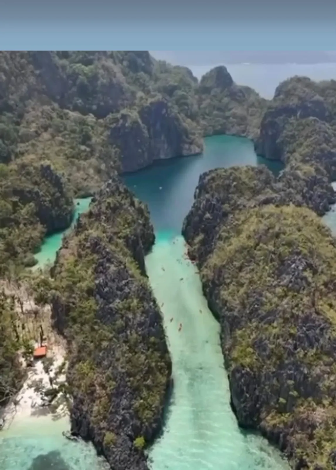 A lagoon between limestone cliffs in El Nido, seen from above