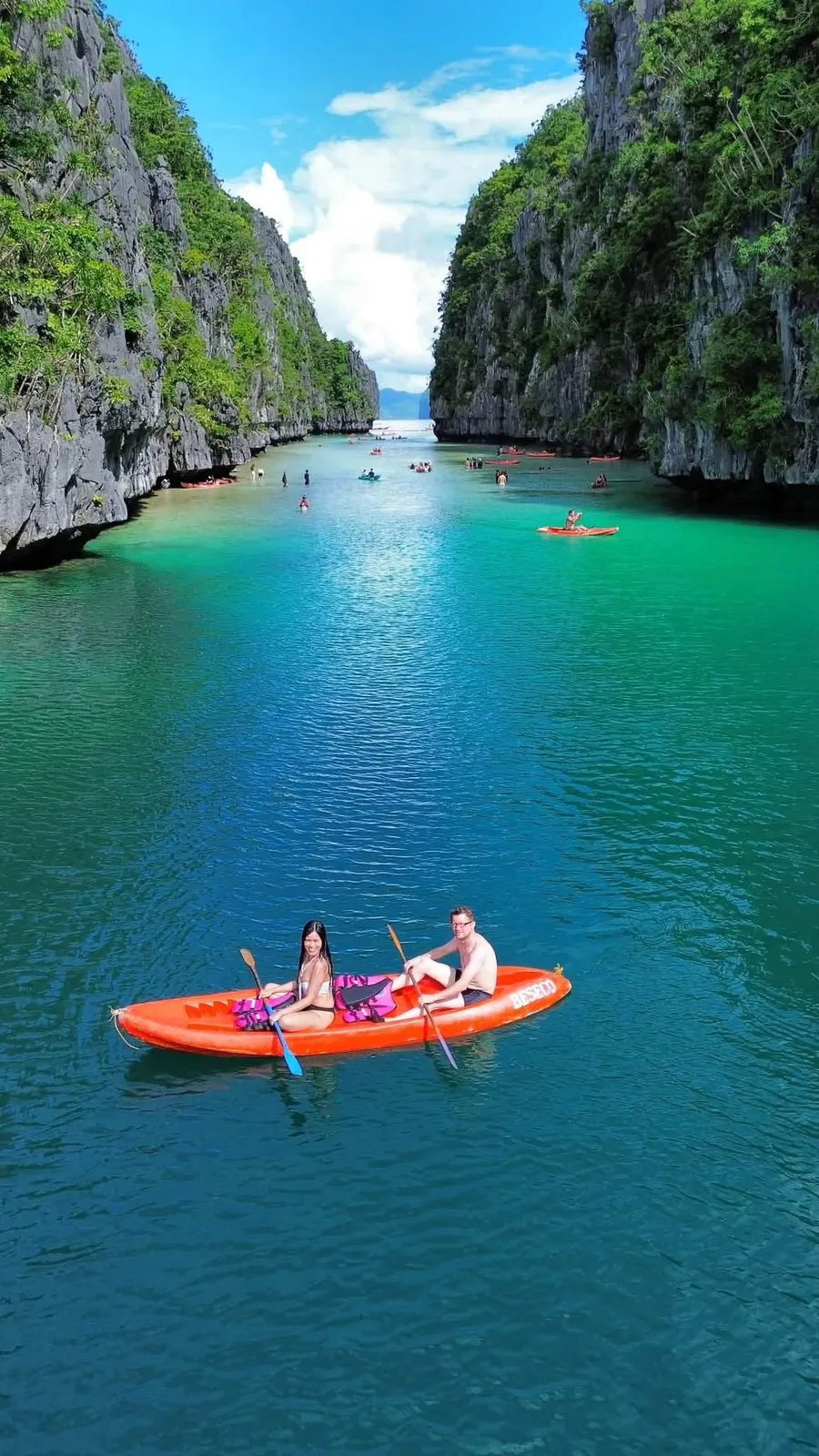 Kayaking into a lagoon between limestone walls in El Nido