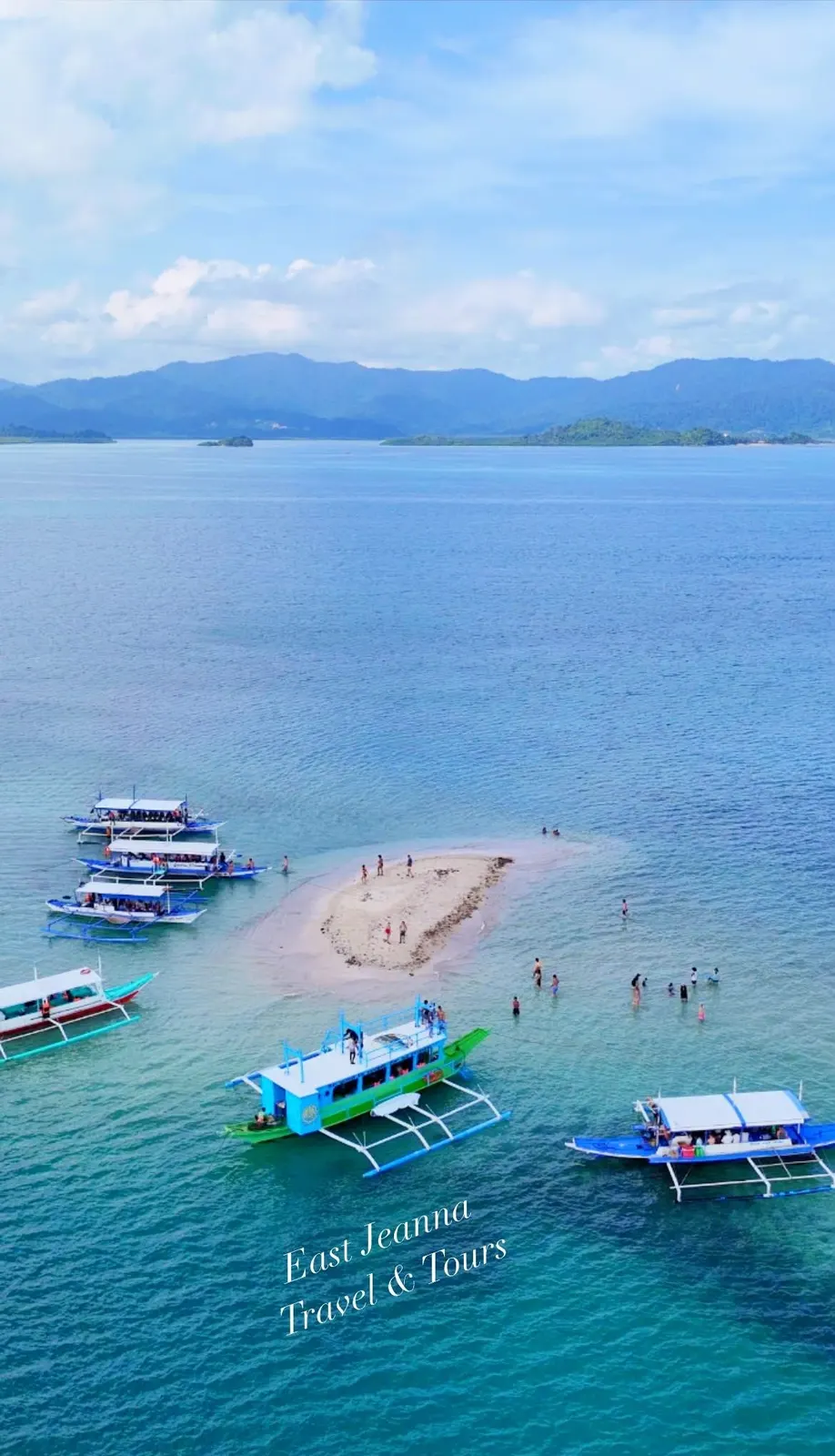 Bangka boats at a sandbar in clear water, watermarked East Jeanna Travel and Tours